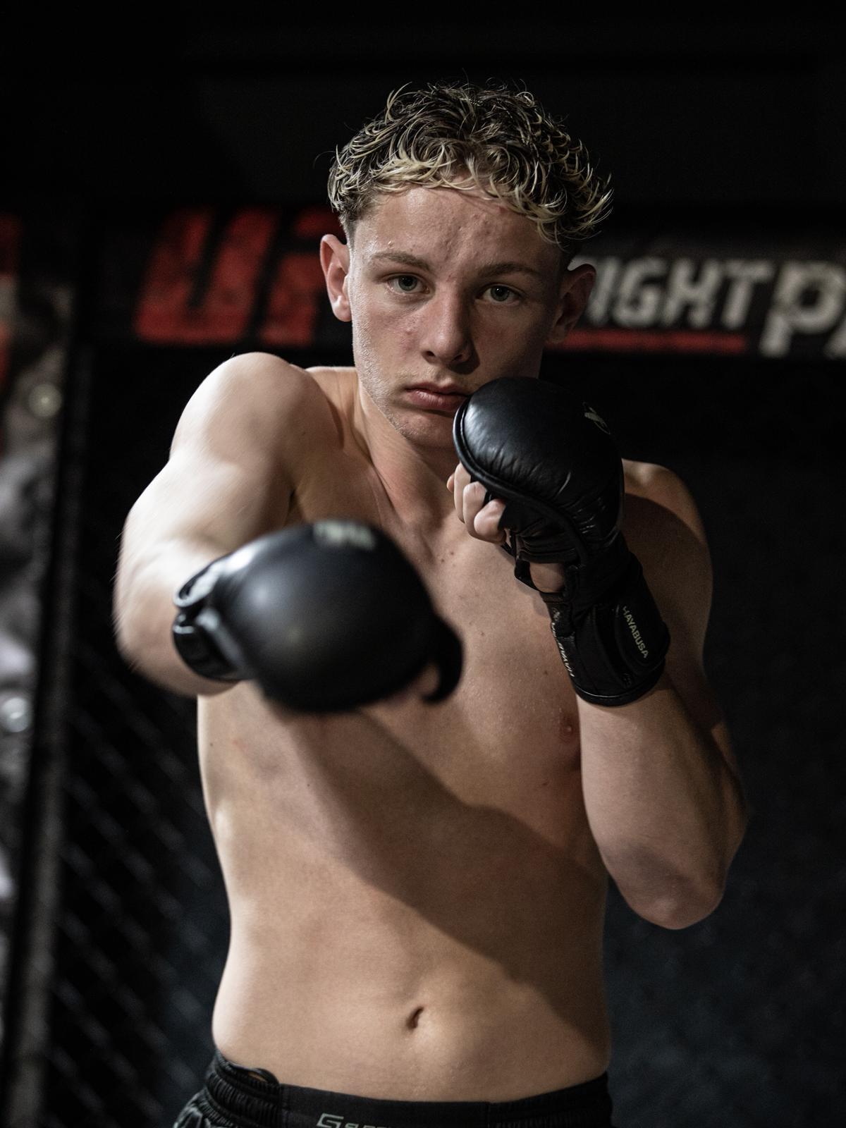Champion fighter walking off the mat with NAGA belt